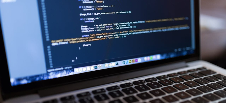 Website code displayed on laptop screen for customization