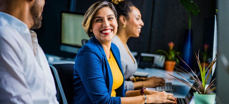 Girl in a blue jacket on a meeting