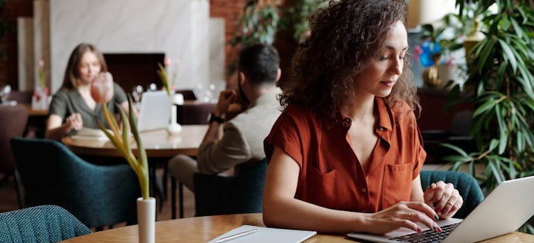 A person using a laptop to post Instagram marketing reels