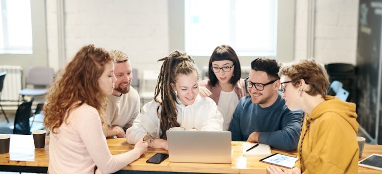 A group of employees people during a meeting on protect your practice from fake reviews
