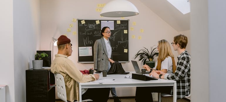 People having a meeting and talking about why client education materials double as marketing tools