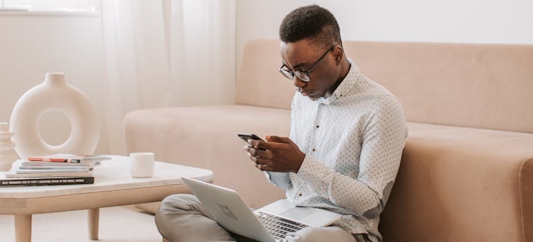 A person using a smartphone to read online reviews