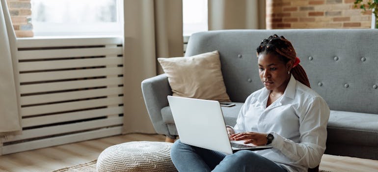 A person using a laptop to look at ratings, which is what families see before they call a rehab center