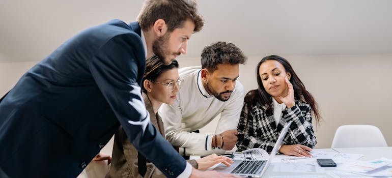 A digital marketing team discussing why you need to check if your website was hit by a Google penalty