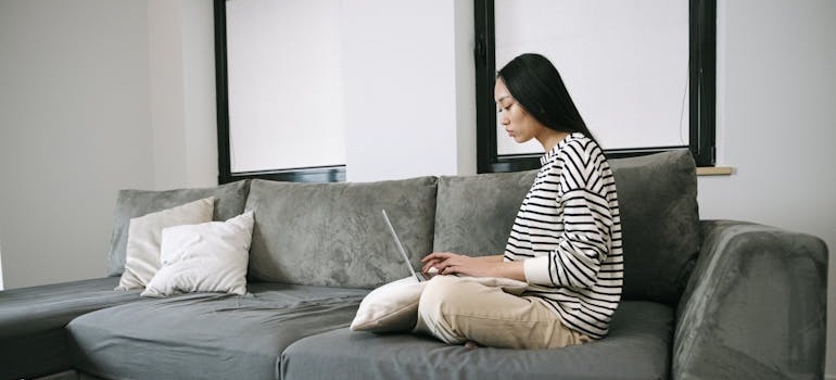 A person using a laptop to look for addiction treatment centers