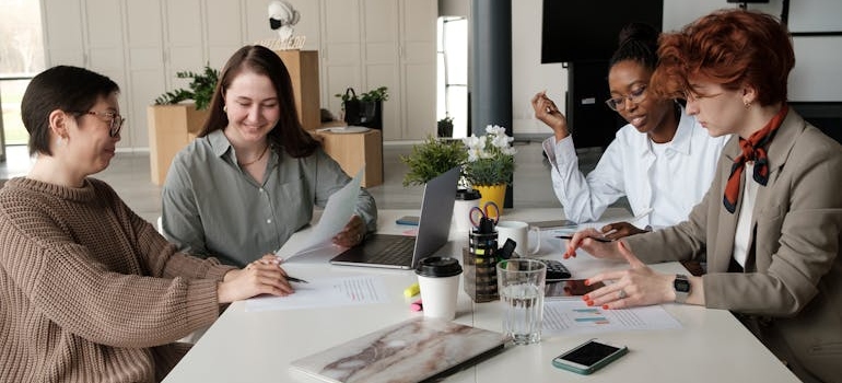 A team of marketing experts discussing calls to action for social media