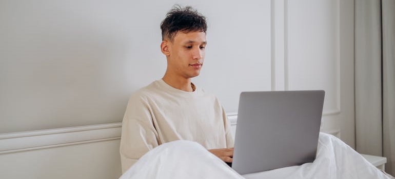 A person using a laptop to explore websites for people in emotional distress