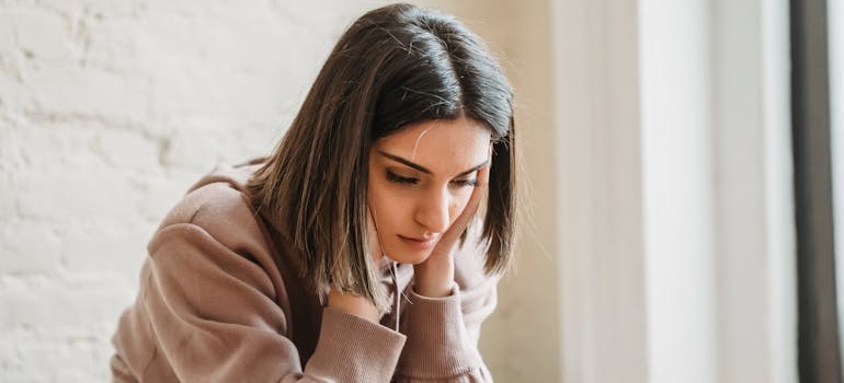 A worried person sitting alone