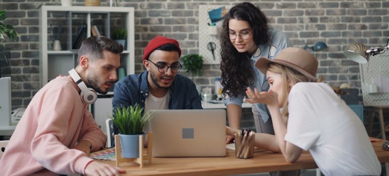 A digital marketing team doing online research on sites for reviews