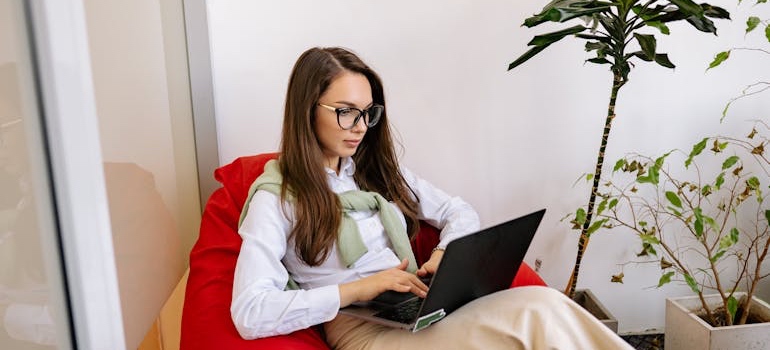 A person using a laptop to search for aesthetic clinics online